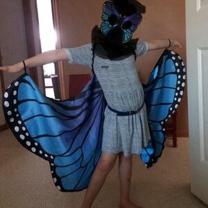 Butterfly wing costume and mask for a child